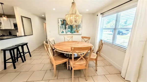 a dining room with furniture and window