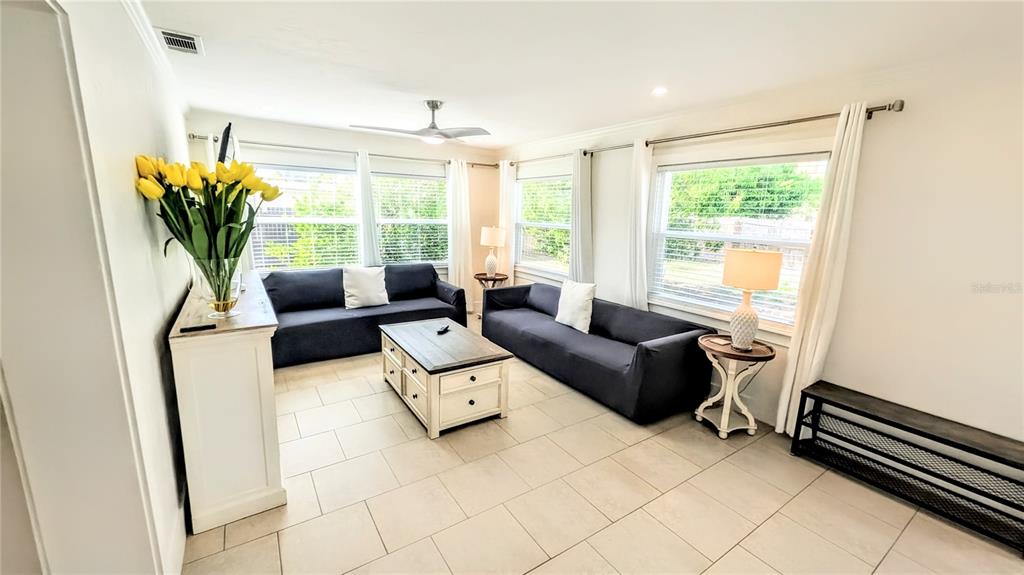 4515 Spahn Street Sarasota, FL 34232 - Photo 10 of 37 a living room with furniture and a large window