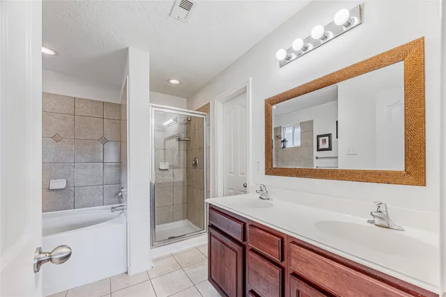 a white bath tub sitting next to a shower