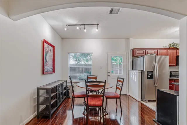 a dining room with furniture and window