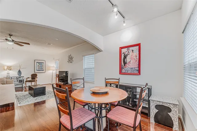 a view of a dining room with furniture and wooden floor