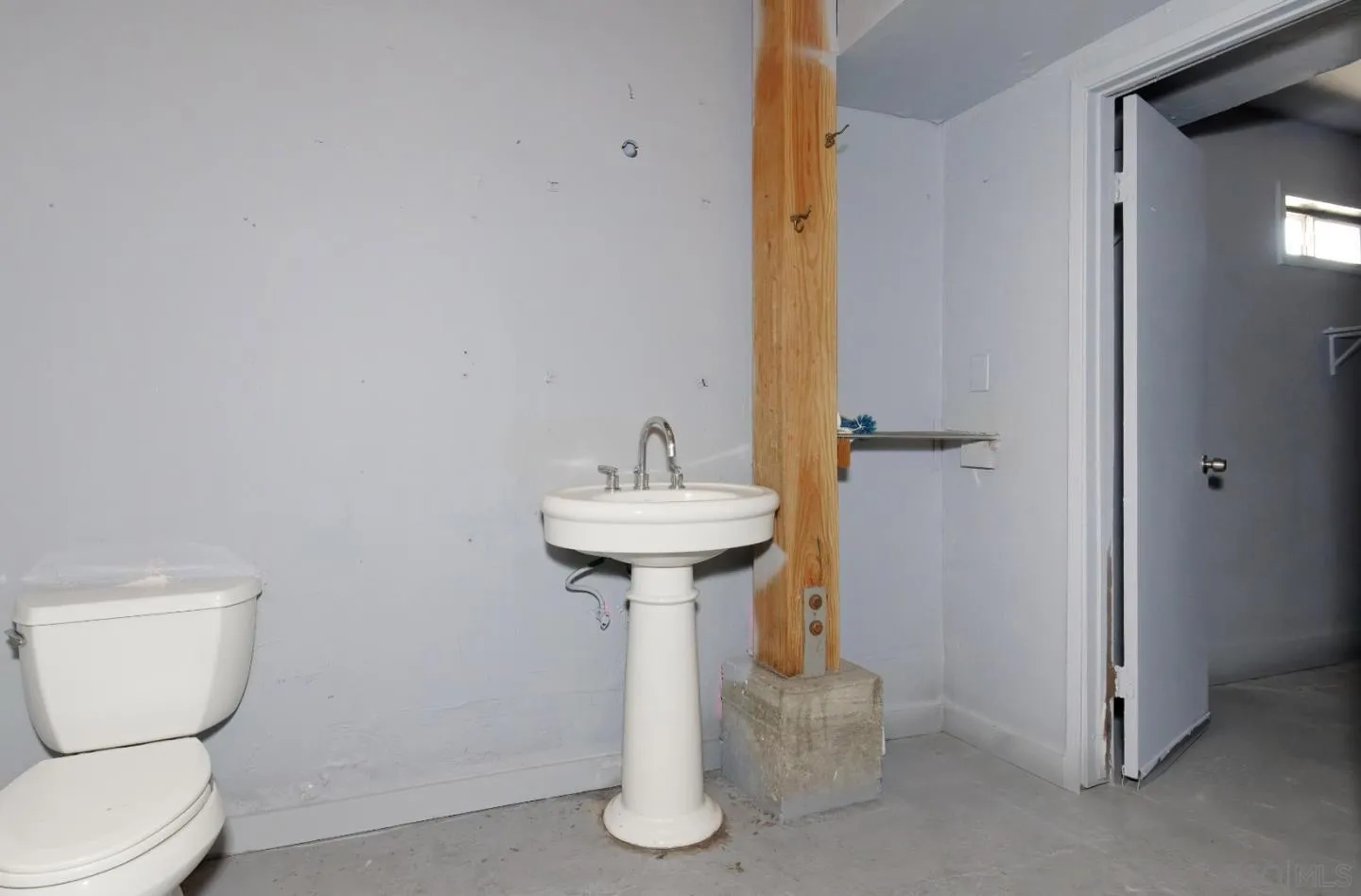 1038 24th Street Oakland, CA 94607 - Photo 11 of 17 a bathroom with a sink toilet and a mirror