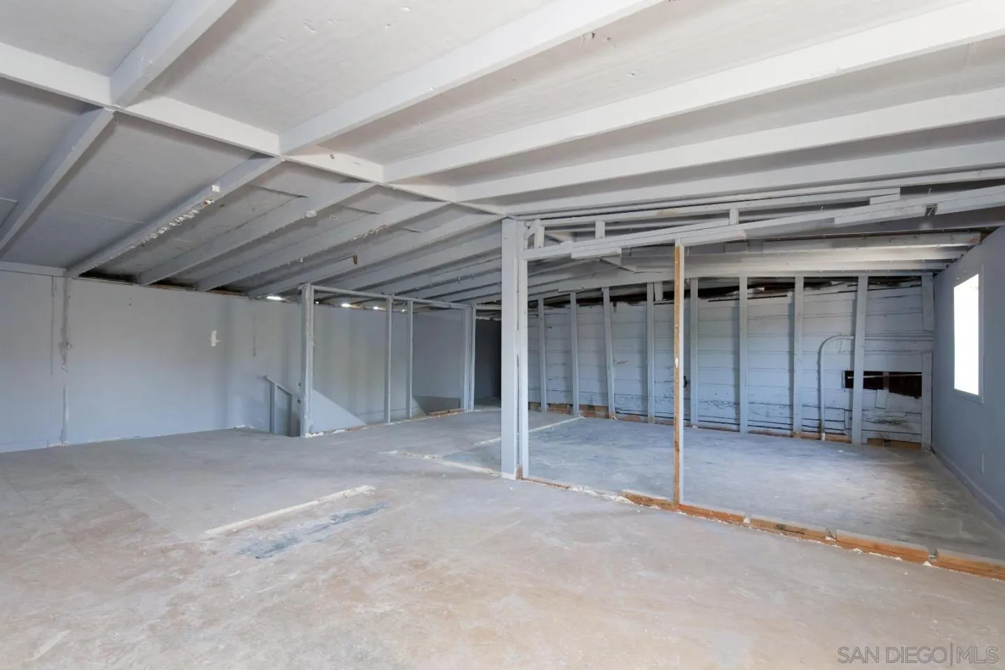 1038 24th Street Oakland, CA 94607 - Photo 15 of 17 a view of an empty room with a staircase