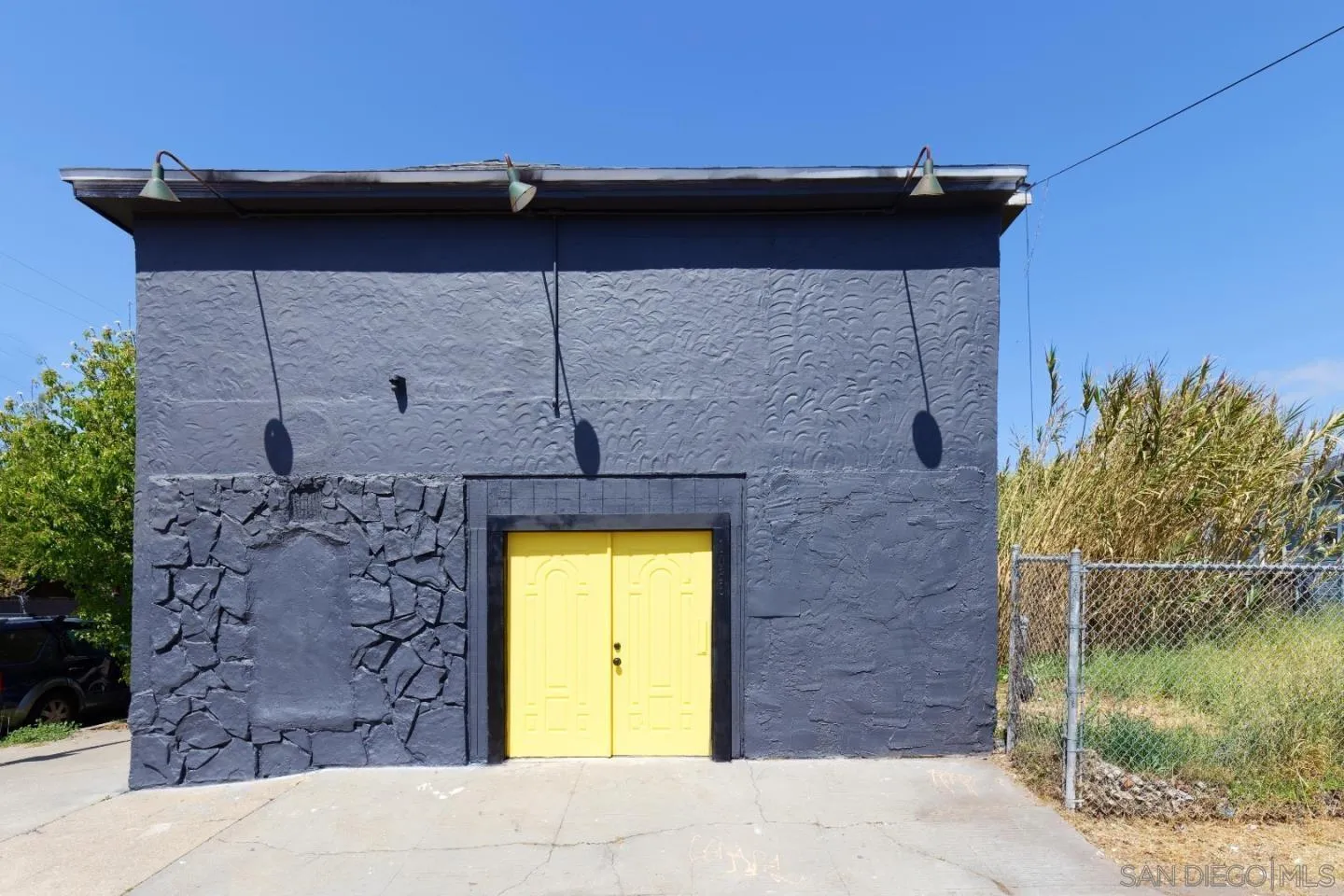 1038 24th Street Oakland, CA 94607 - Photo 16 of 17 a brick house with a small yard