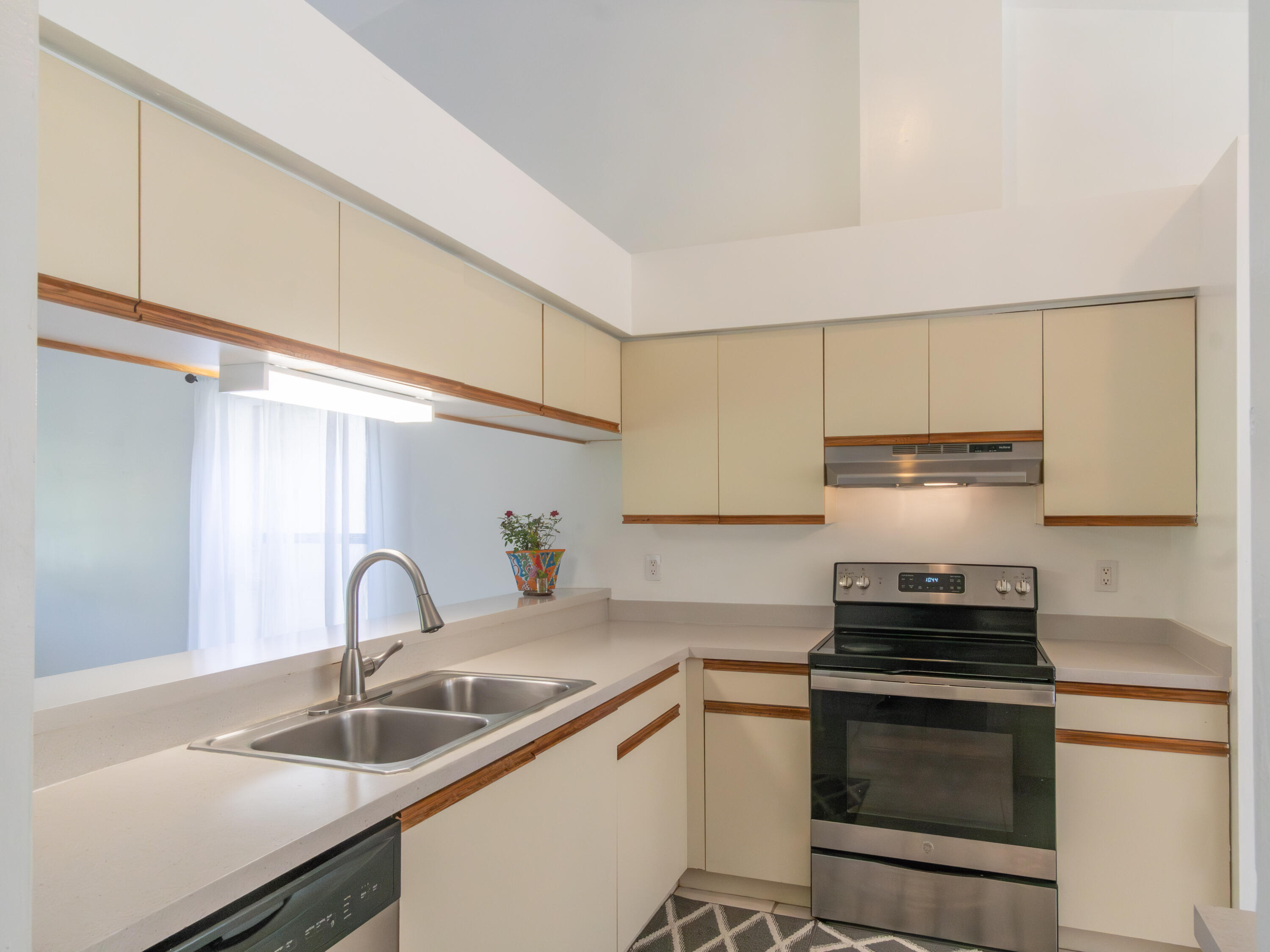 1404 Monarch Naples, FL 34116 - Photo 14 of 33 a kitchen with a sink and a stove top oven