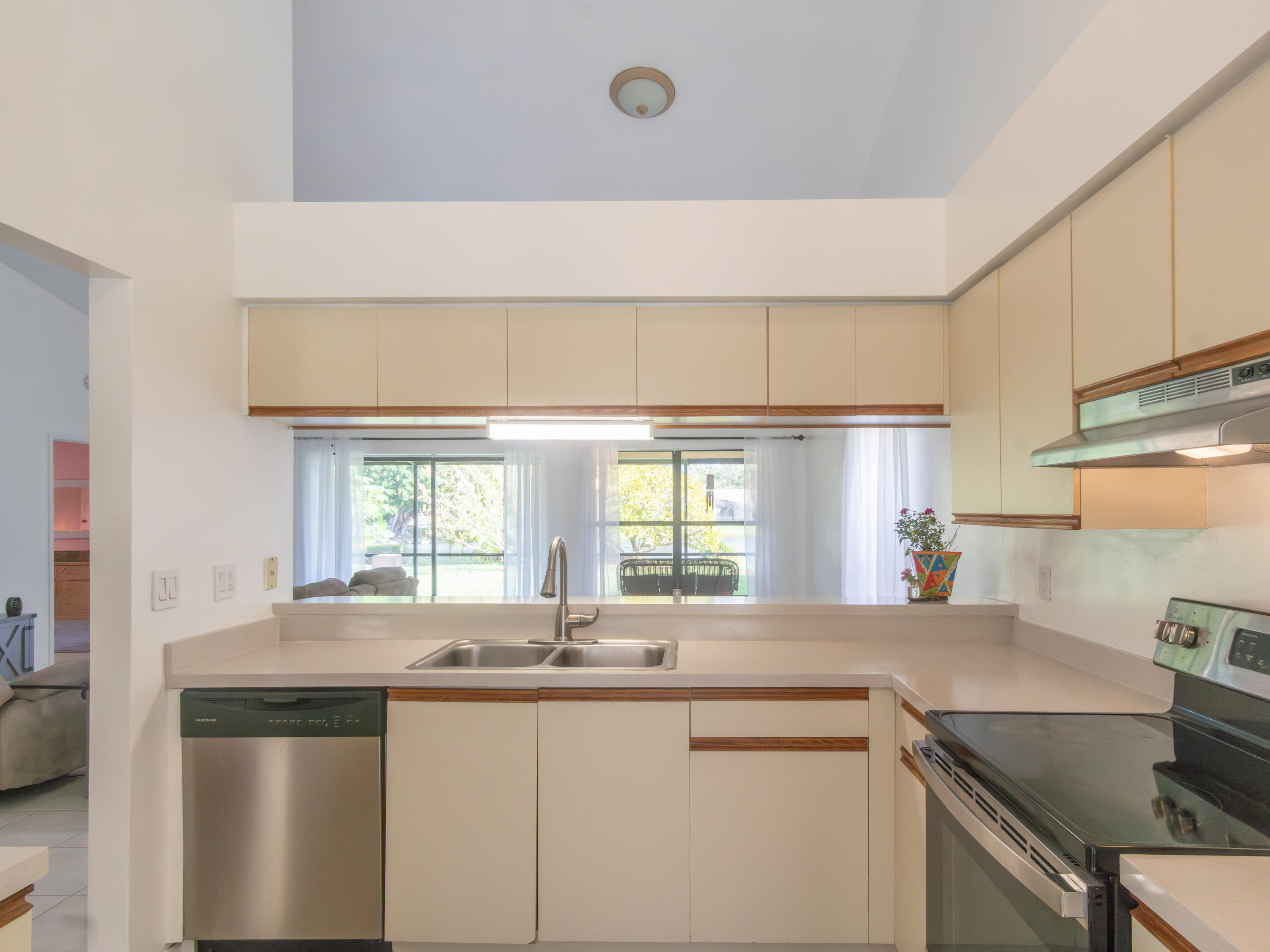1404 Monarch Naples, FL 34116 - Photo 15 of 33 a kitchen with a sink and cabinets