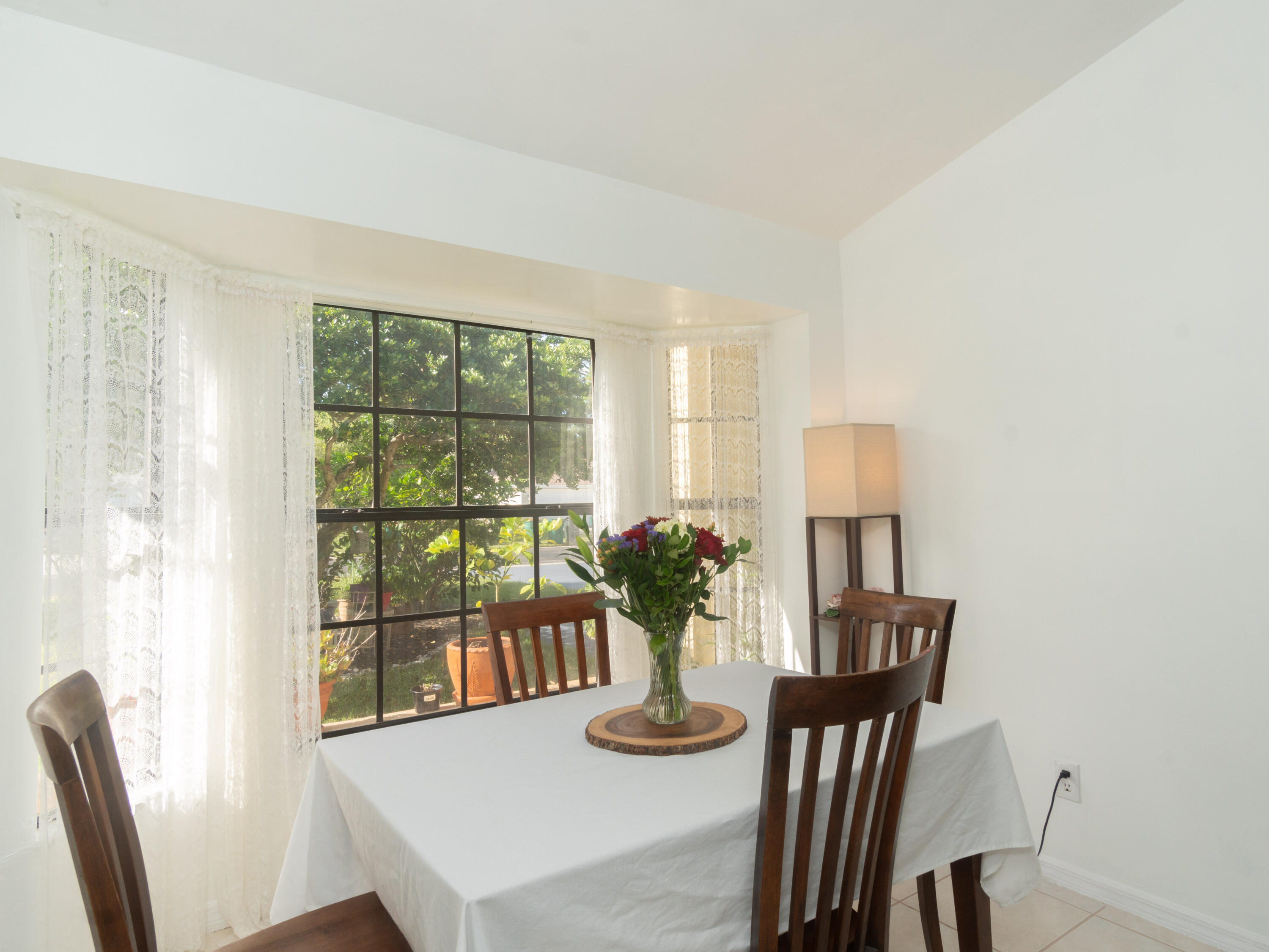 1404 Monarch Naples, FL 34116 - Photo 17 of 33 a dining room with furniture and wooden floor