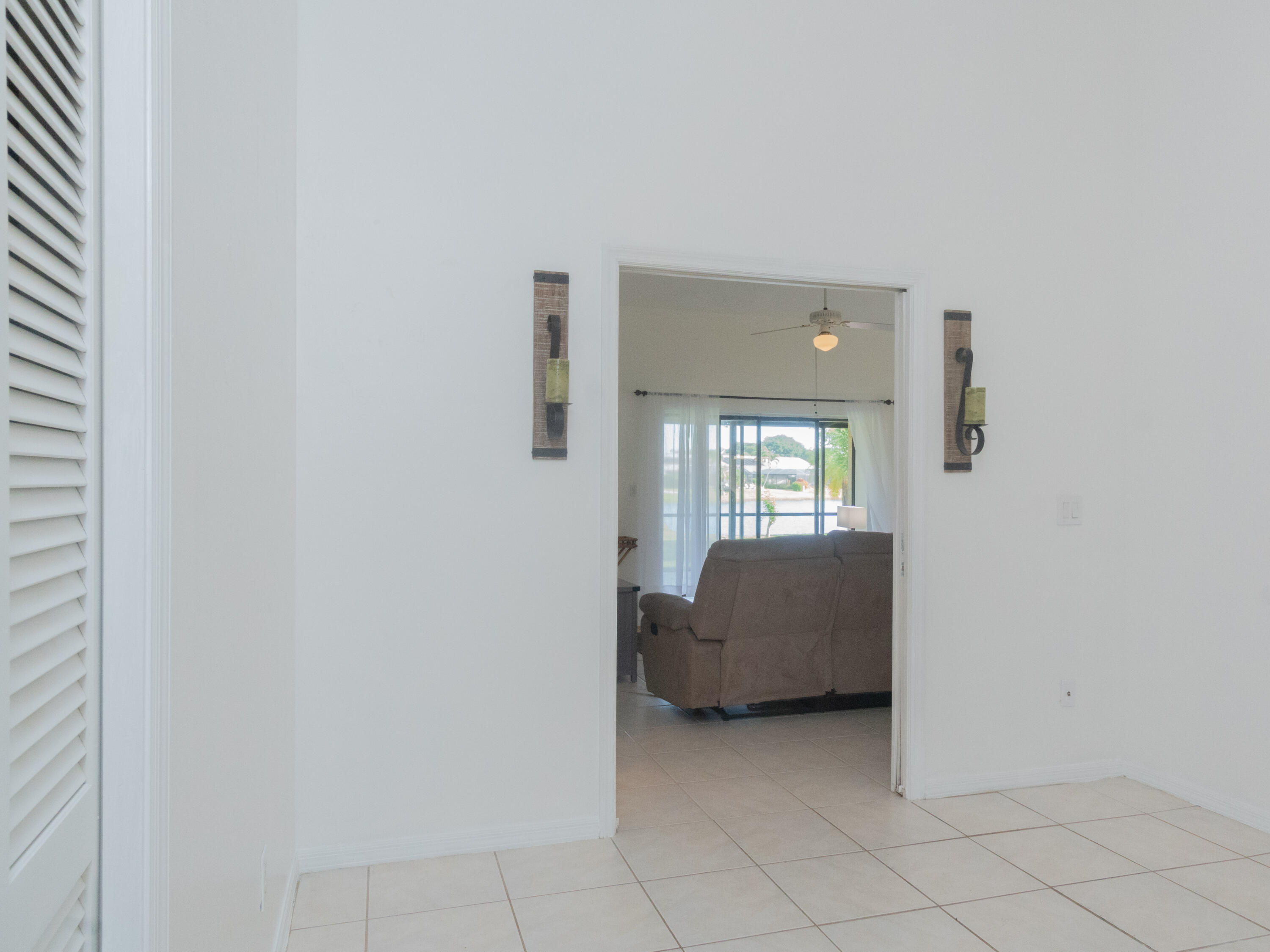1404 Monarch Naples, FL 34116 - Photo 24 of 33 a living room with furniture and a window