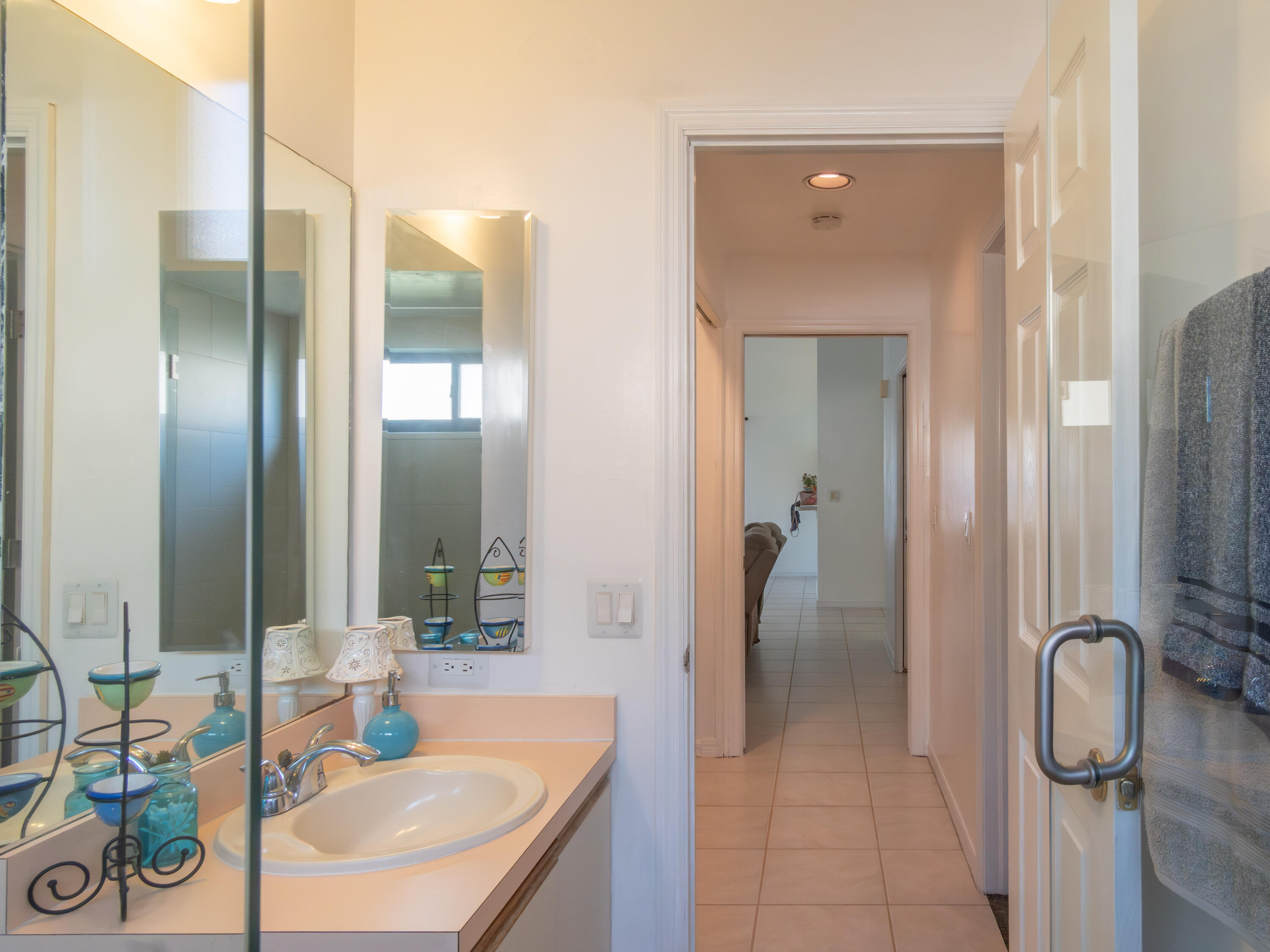 1404 Monarch Naples, FL 34116 - Photo 26 of 33 a bathroom with a sink and a mirror