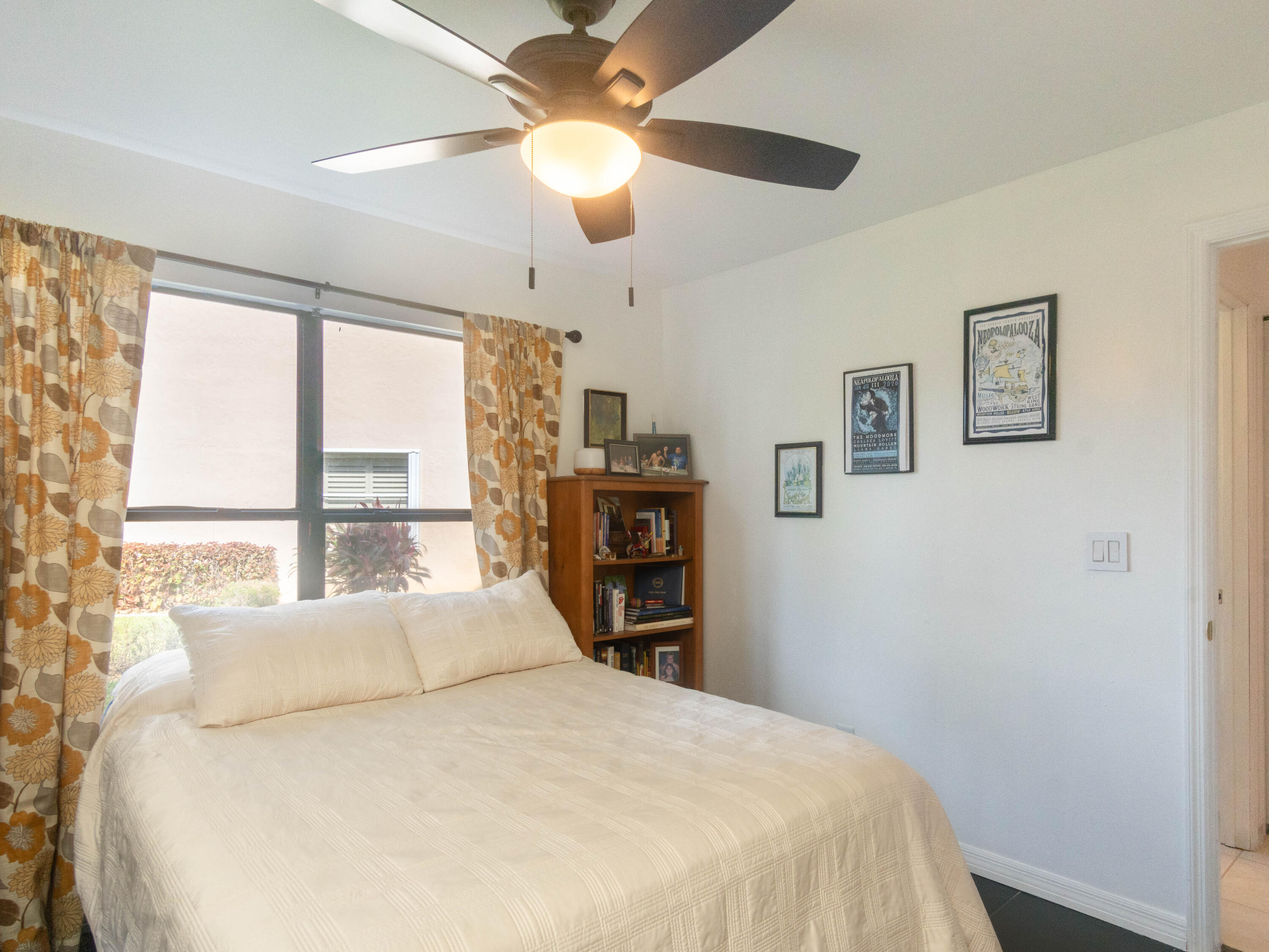 1404 Monarch Naples, FL 34116 - Photo 28 of 33 a bedroom with a large bed and a large window