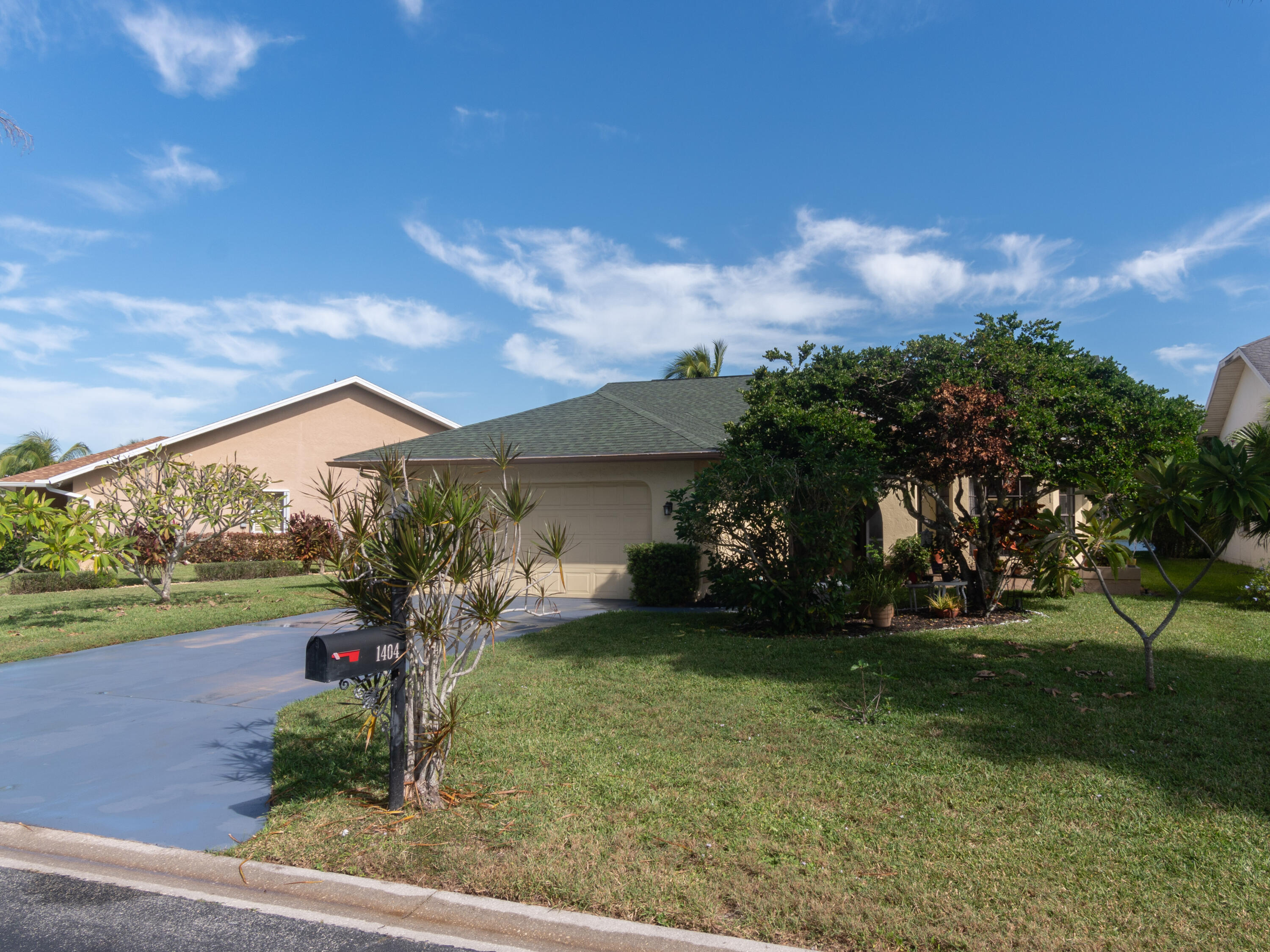 1404 Monarch Naples, FL 34116 - Photo 6 of 33 a front view of a house with garden