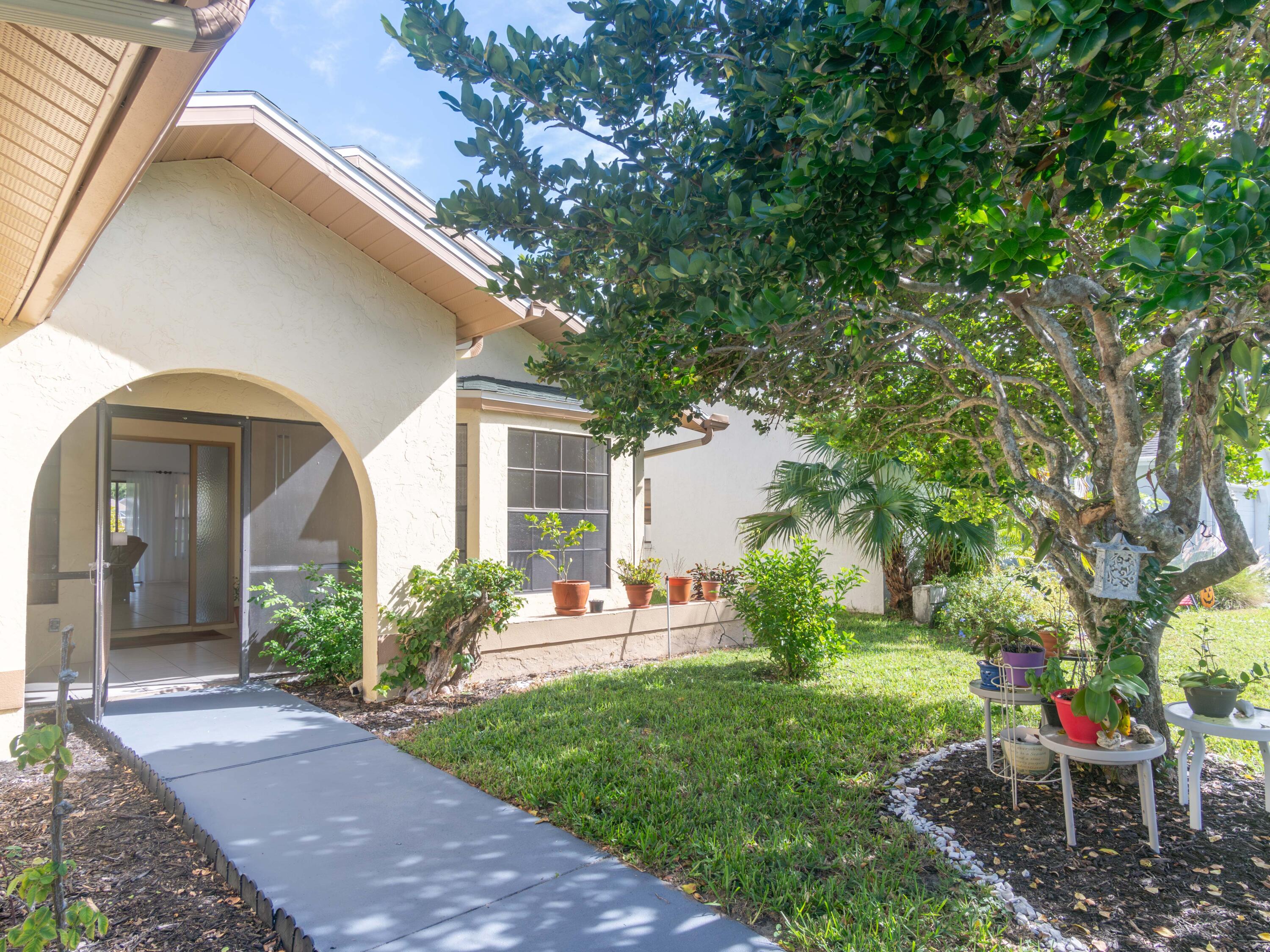 1404 Monarch Naples, FL 34116 - Photo 7 of 33 a view of a house with backyard and a garden