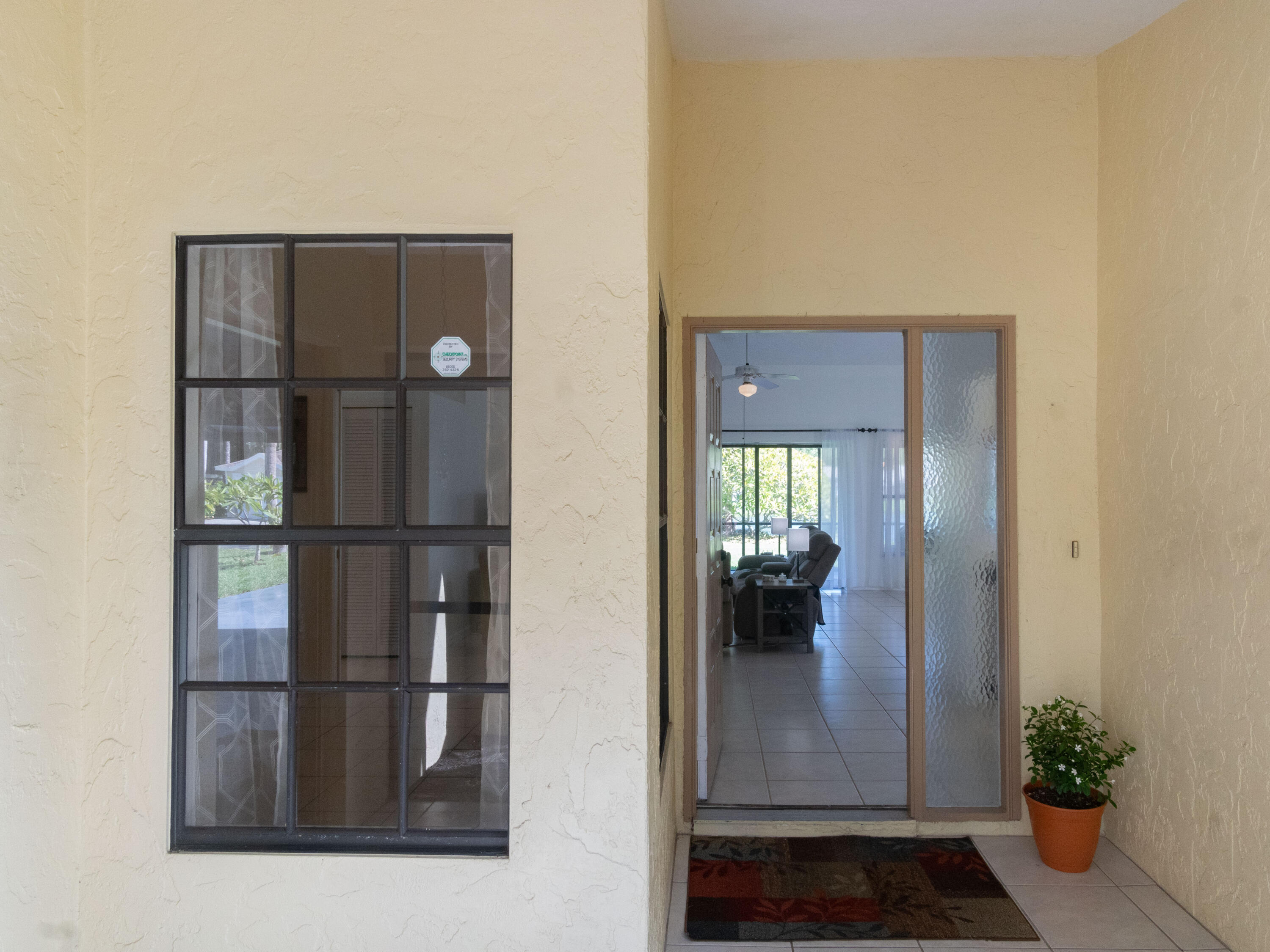 1404 Monarch Naples, FL 34116 - Photo 9 of 33 a view of a hallway with wooden floor and dining room view