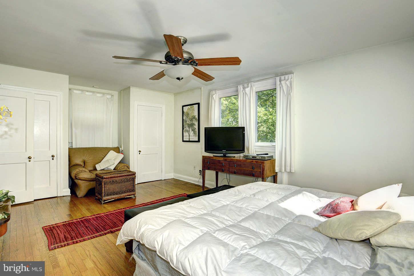 3718 Croydon Road Baltimore, MD 21207 - Photo 14 of 25 a bedroom with a bed and a flat screen tv
