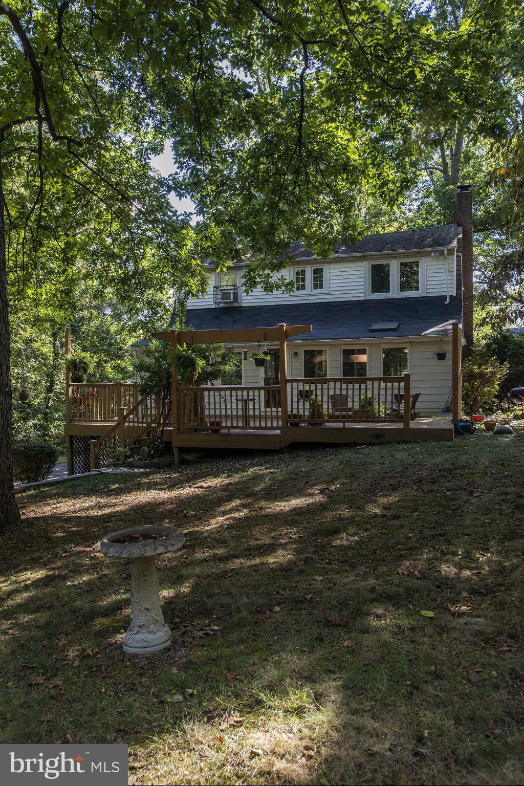 3718 Croydon Road Baltimore, MD 21207 - Photo 22 of 25 a front view of a house with a garden