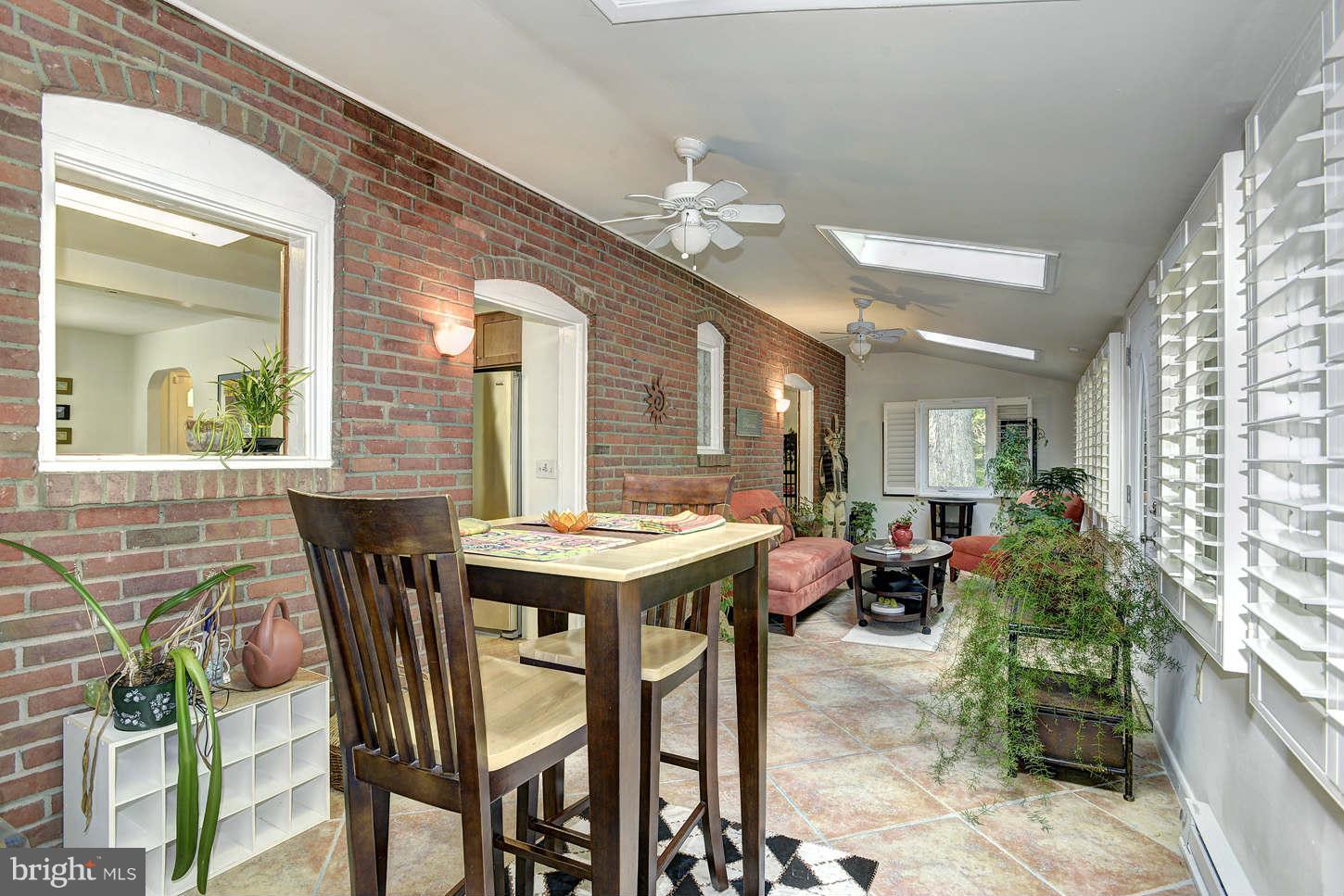 3718 Croydon Road Baltimore, MD 21207 - Photo 8 of 25 a view of a dining room with furniture and window