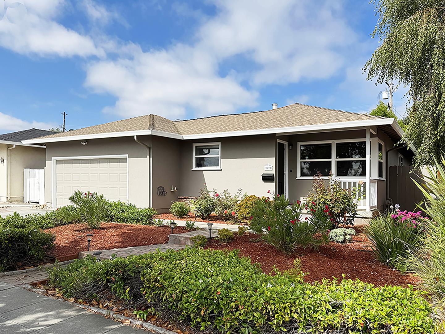 a front view of house with yard and outdoor seating