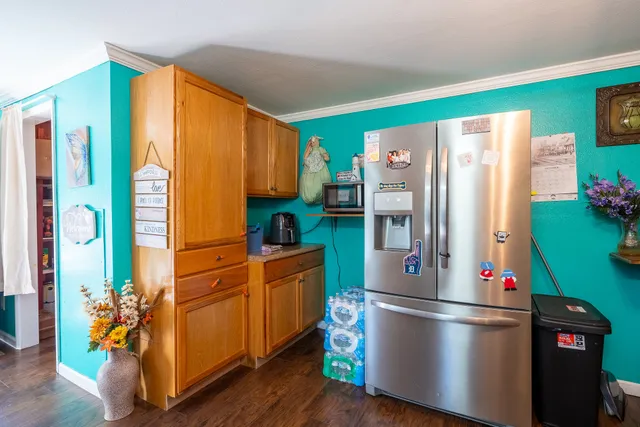 a kitchen with stainless steel appliances granite countertop a sink and cabinets