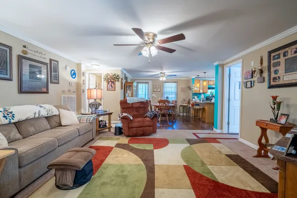 a living room with furniture and a flat screen tv