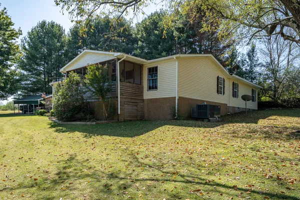 a house with trees in the background
