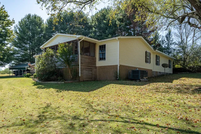 a house with trees in the background