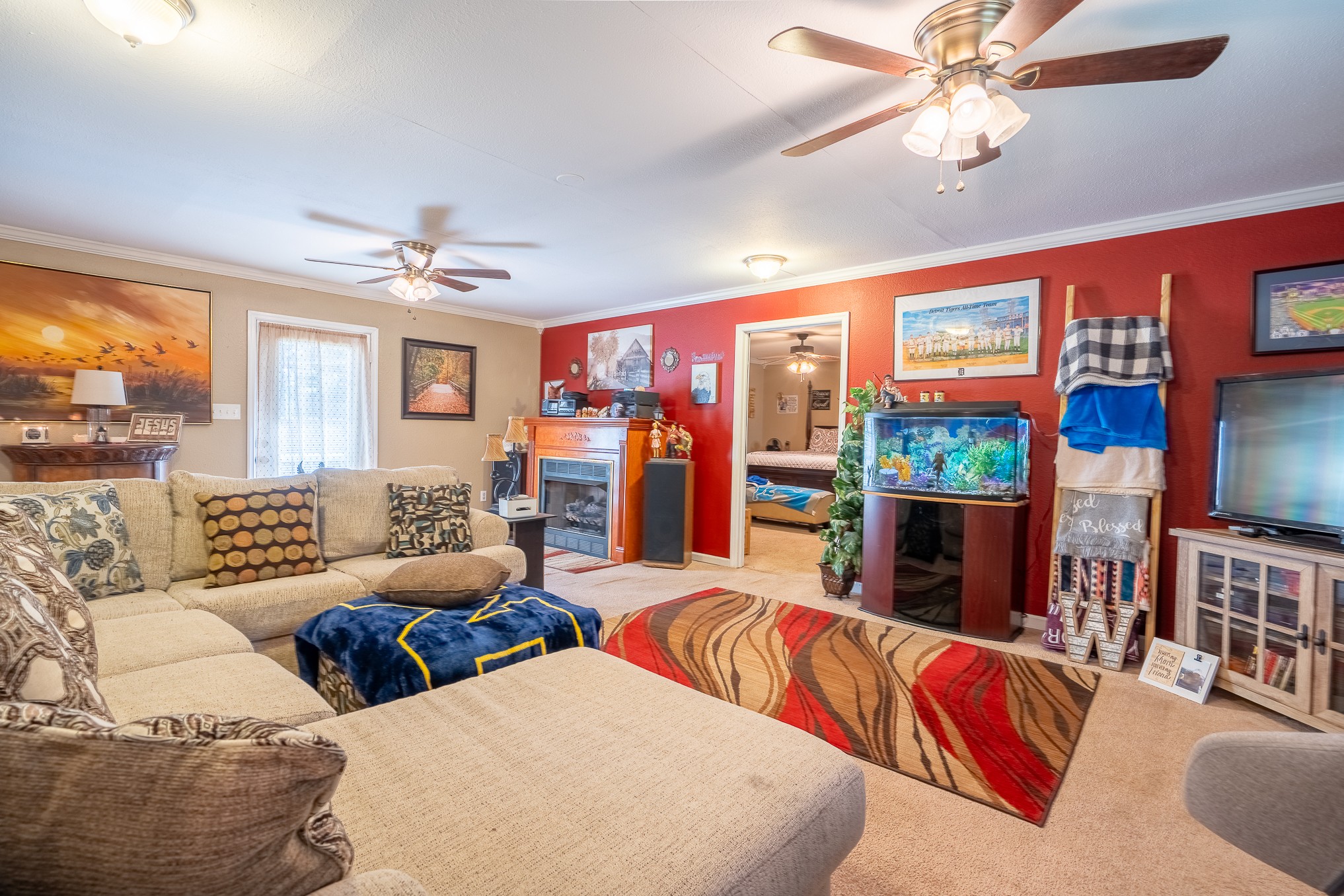 2862 Highway 43 South Loretto, TN 38469 - Photo 33 of 40 a living room with furniture a flat screen tv and a large window
