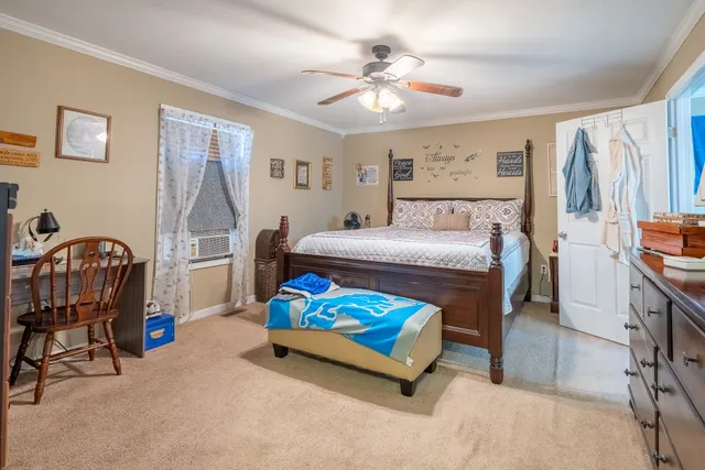 a view of walk in closet with clothes
