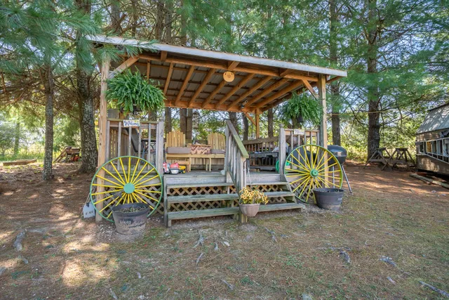 a wooden bench sitting in front of a house