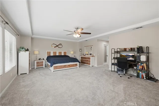 a bedroom with furniture and a window