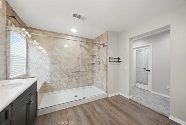 a bathroom with a double vanity sink and a mirror