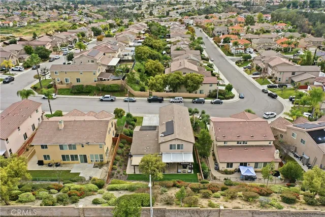 a living room with a floor to ceiling window and a table