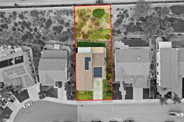 a front view of a house with garden and patio