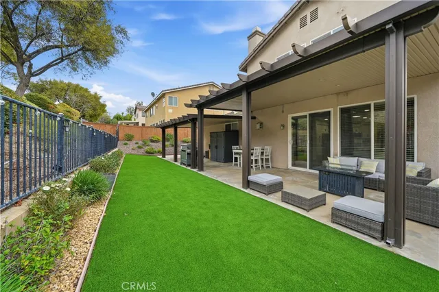 an aerial view of multiple houses with a yard