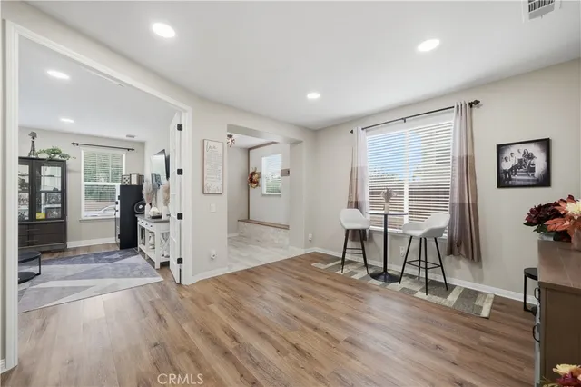 a view of entryway with wooden floor