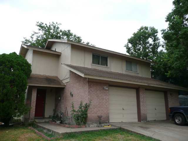 2611 Metcalfe Road Austin, TX 78741 - Photo 1 of 1 a view of a house with a yard and garage