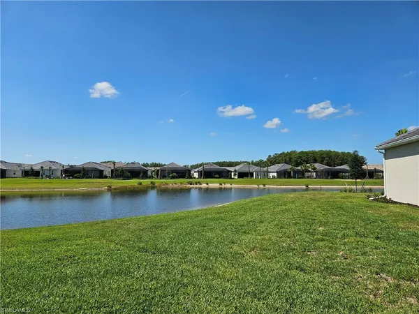 a view of a lake with a big yard