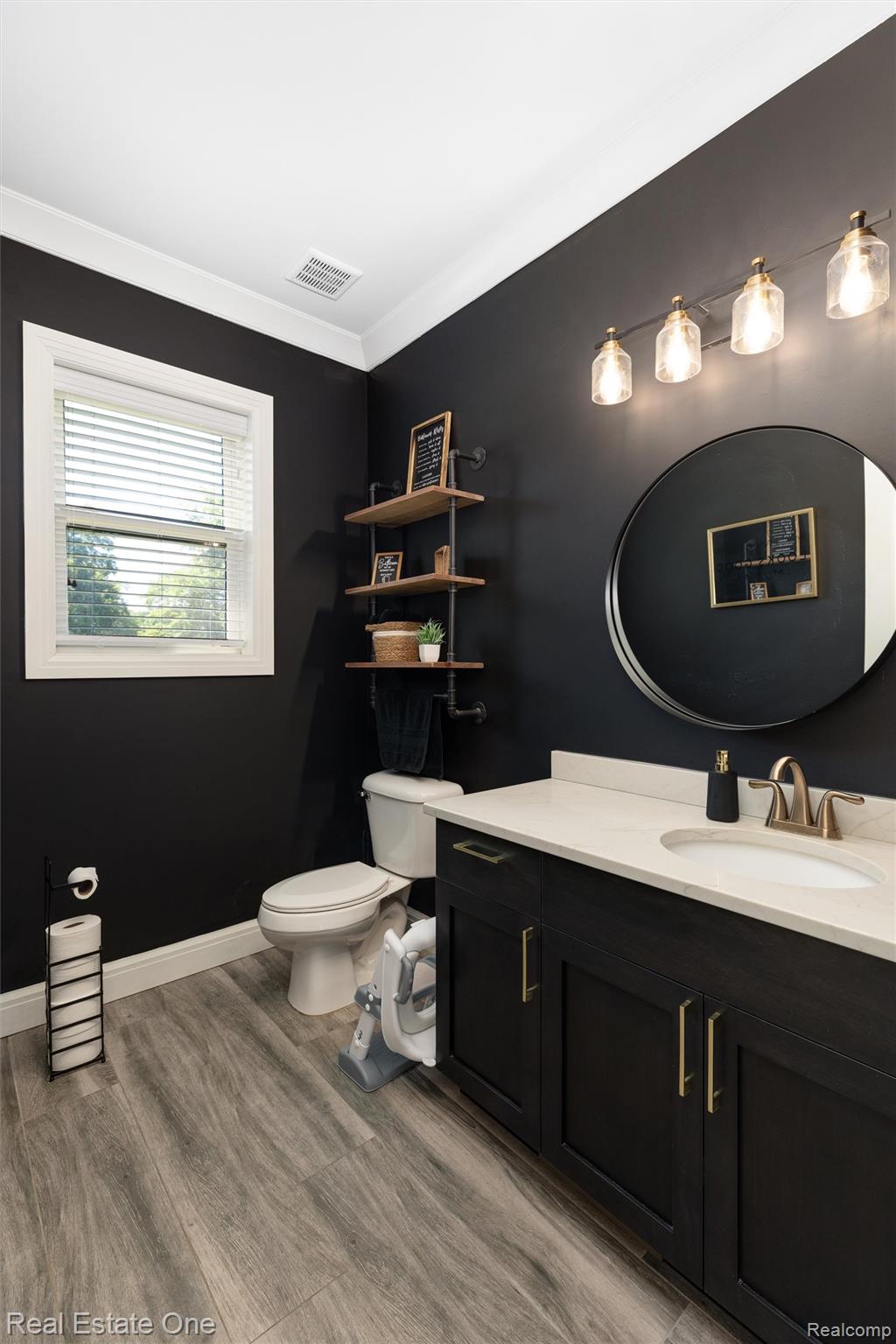 2983 28 Mile Road Washington, MI 48094 - Photo 7 of 54 Bathroom featuring a dark wood-finish vanity with a light-toned countertop and an undermount sink