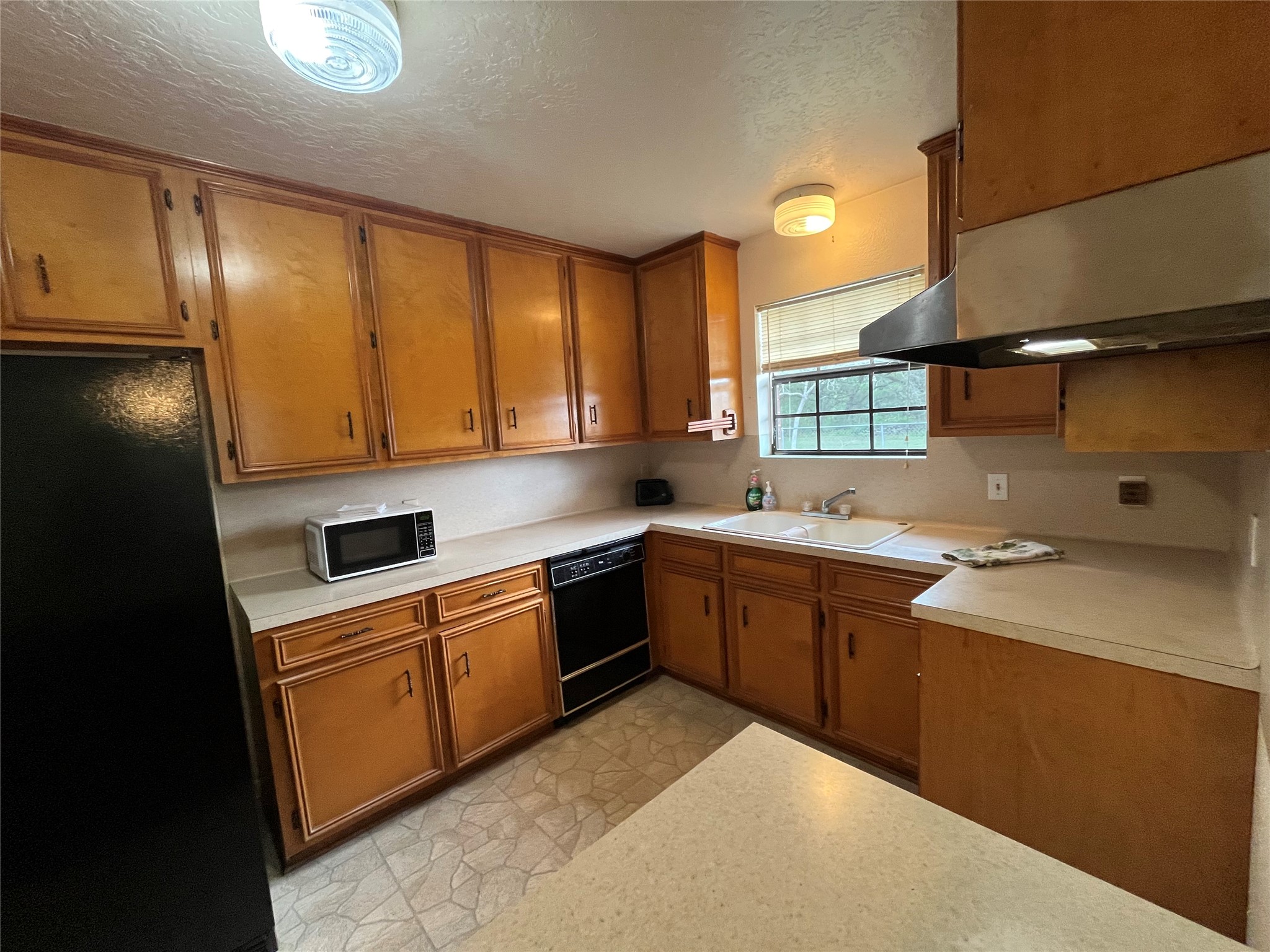 1475 Cr 16 Road Garwood, TX 77442 - Photo 16 of 43 a kitchen with a sink cabinets and window