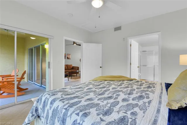 a bathroom with a toilet a sink a mirror and a shower