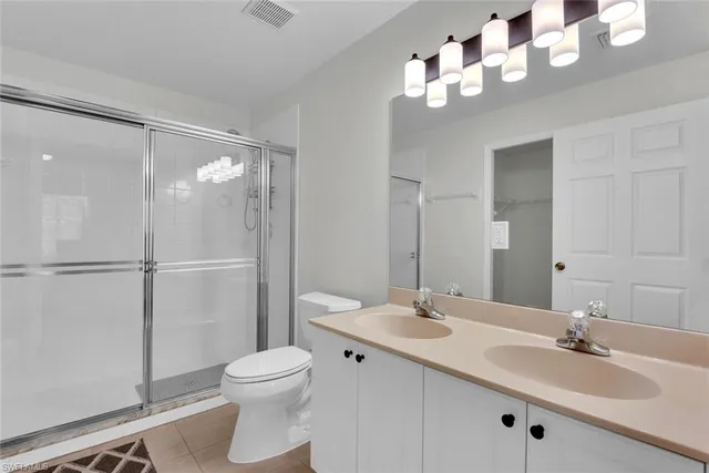 a bedroom with bed and window