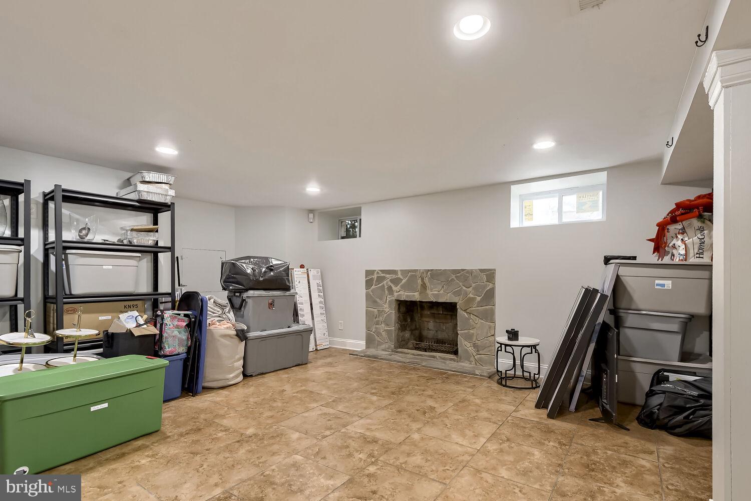 4012 Hillen Road Baltimore, MD 21218 - Photo 11 of 14 Spacious basement with cozy fireplace.