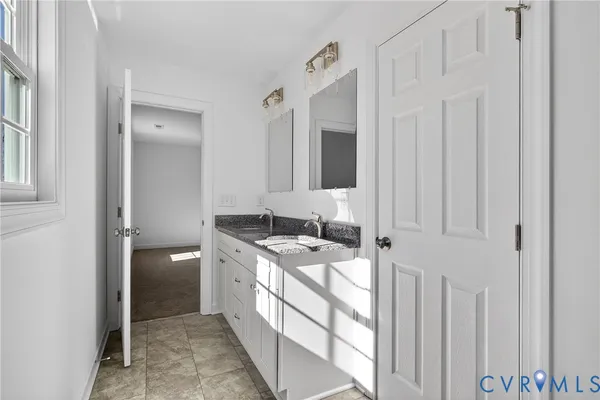 a bathroom with a toilet and a sink