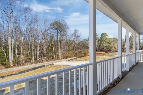 a view of a balcony with wooden floor
