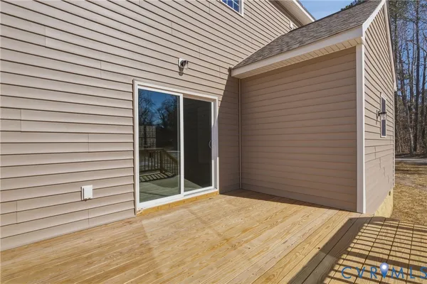 a view of balcony with wooden floor