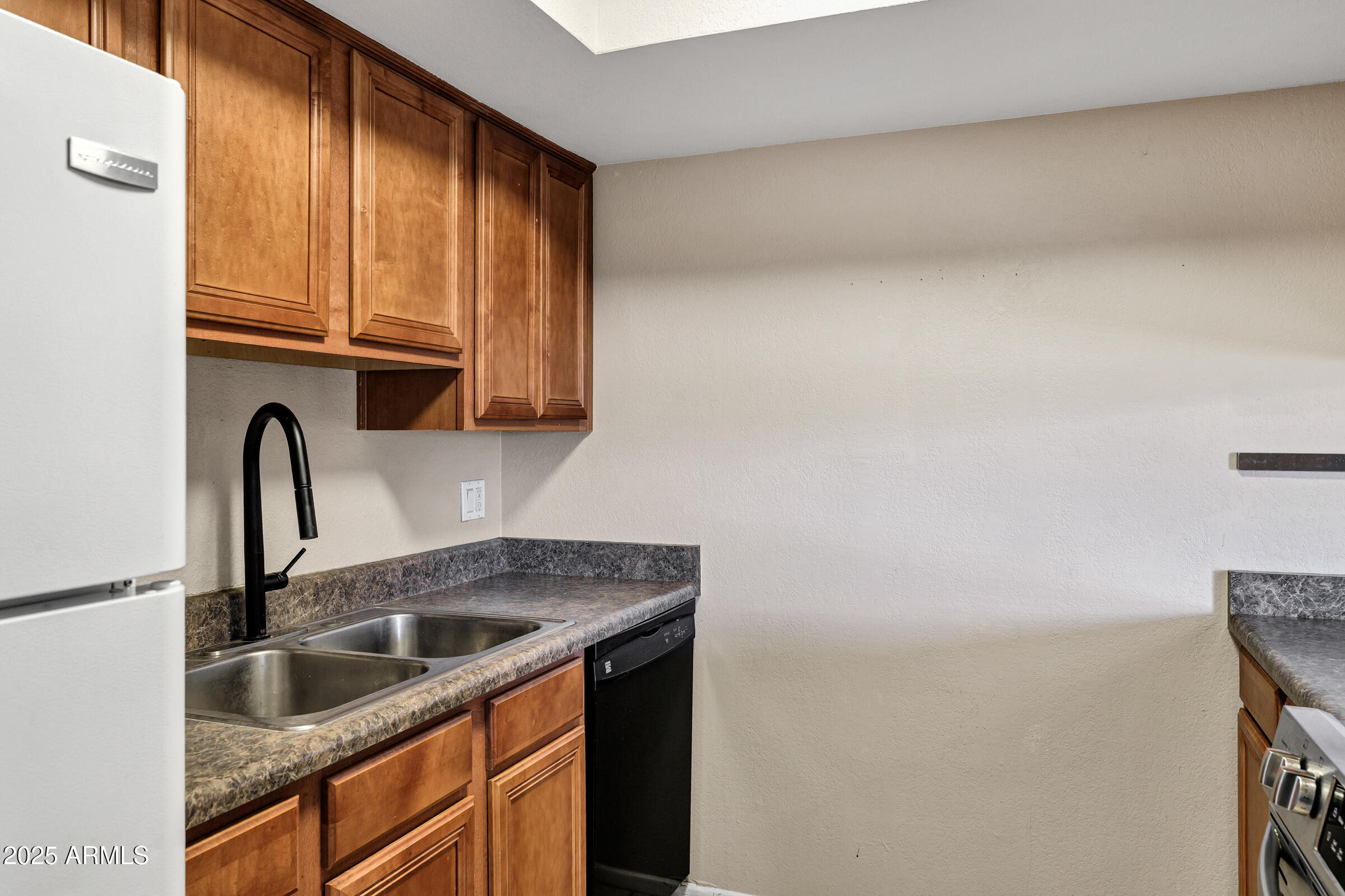 1402 East Guadalupe Road, Unit 248 Tempe, AZ 85283 - Photo 11 of 27 a kitchen with a sink cabinets and a window