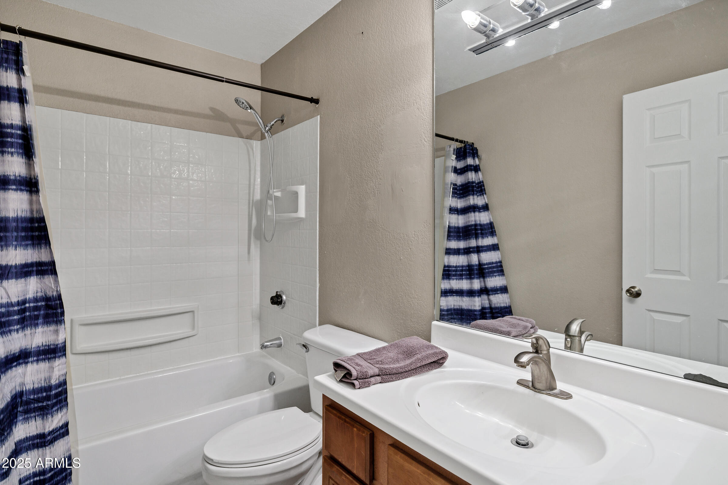1402 East Guadalupe Road, Unit 248 Tempe, AZ 85283 - Photo 14 of 27 a bathroom with a sink toilet and shower