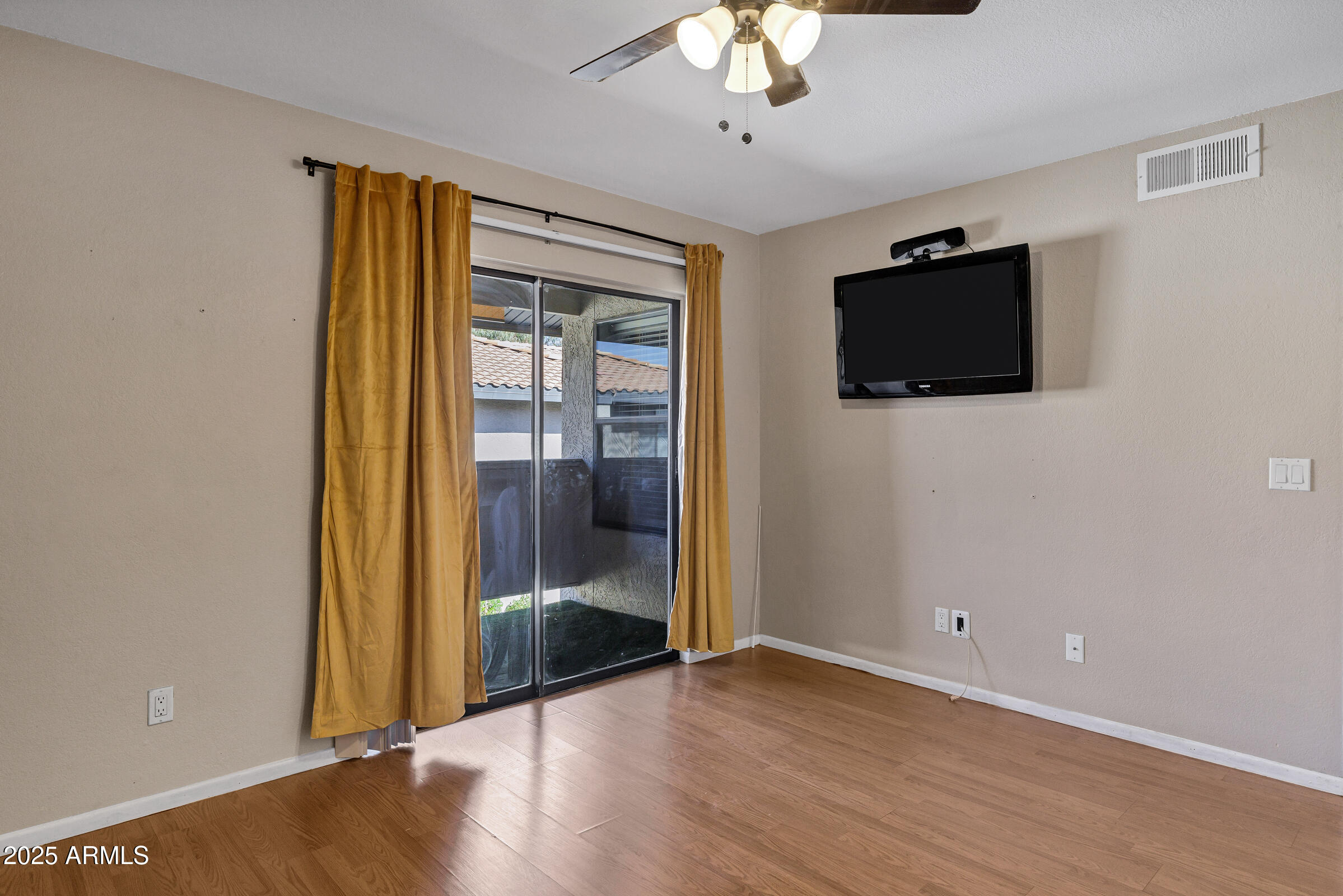 1402 East Guadalupe Road, Unit 248 Tempe, AZ 85283 - Photo 16 of 27 wooden floor in an empty room with a window