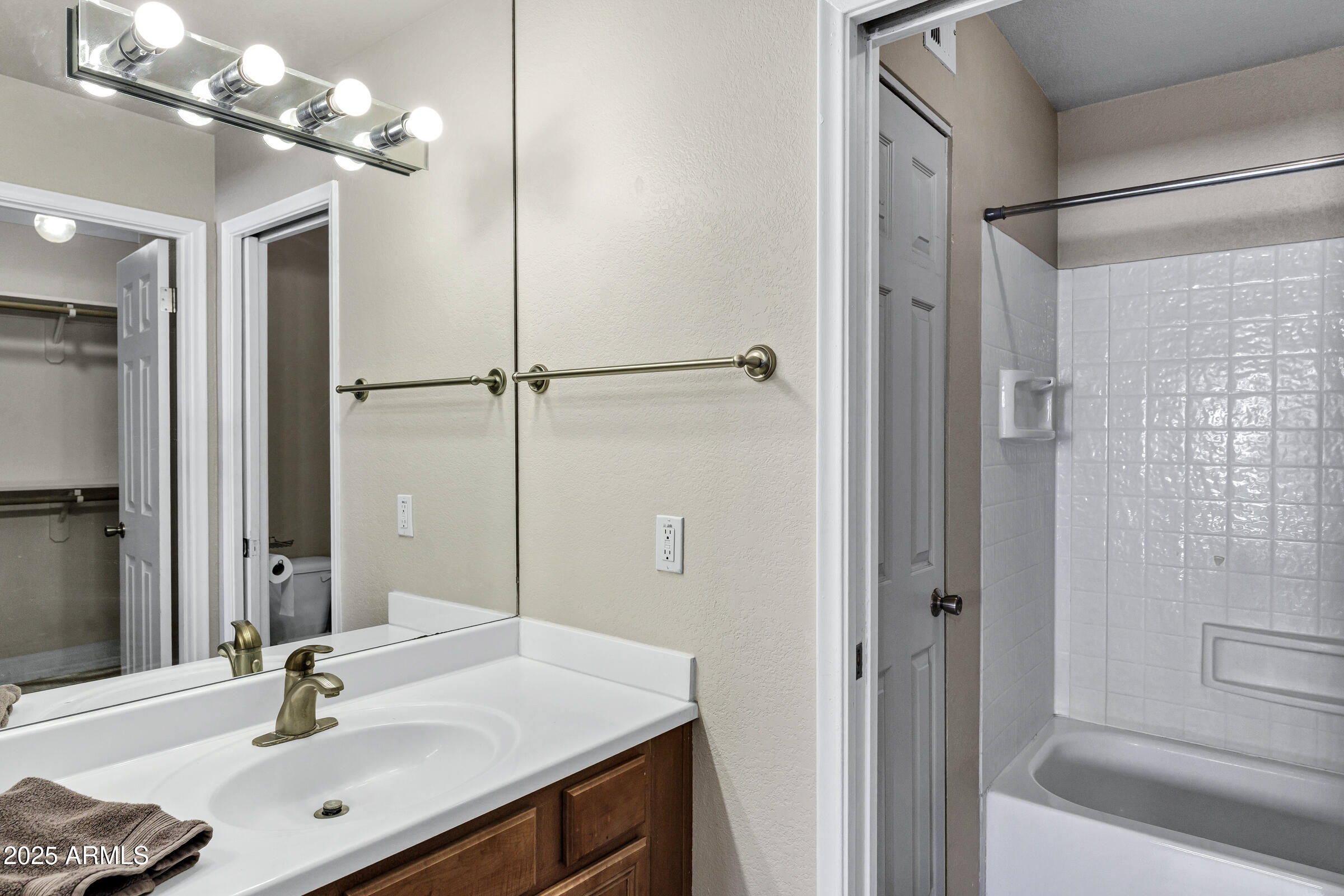 1402 East Guadalupe Road, Unit 248 Tempe, AZ 85283 - Photo 17 of 27 a bathroom with a sink vanity granite shower and a mirror