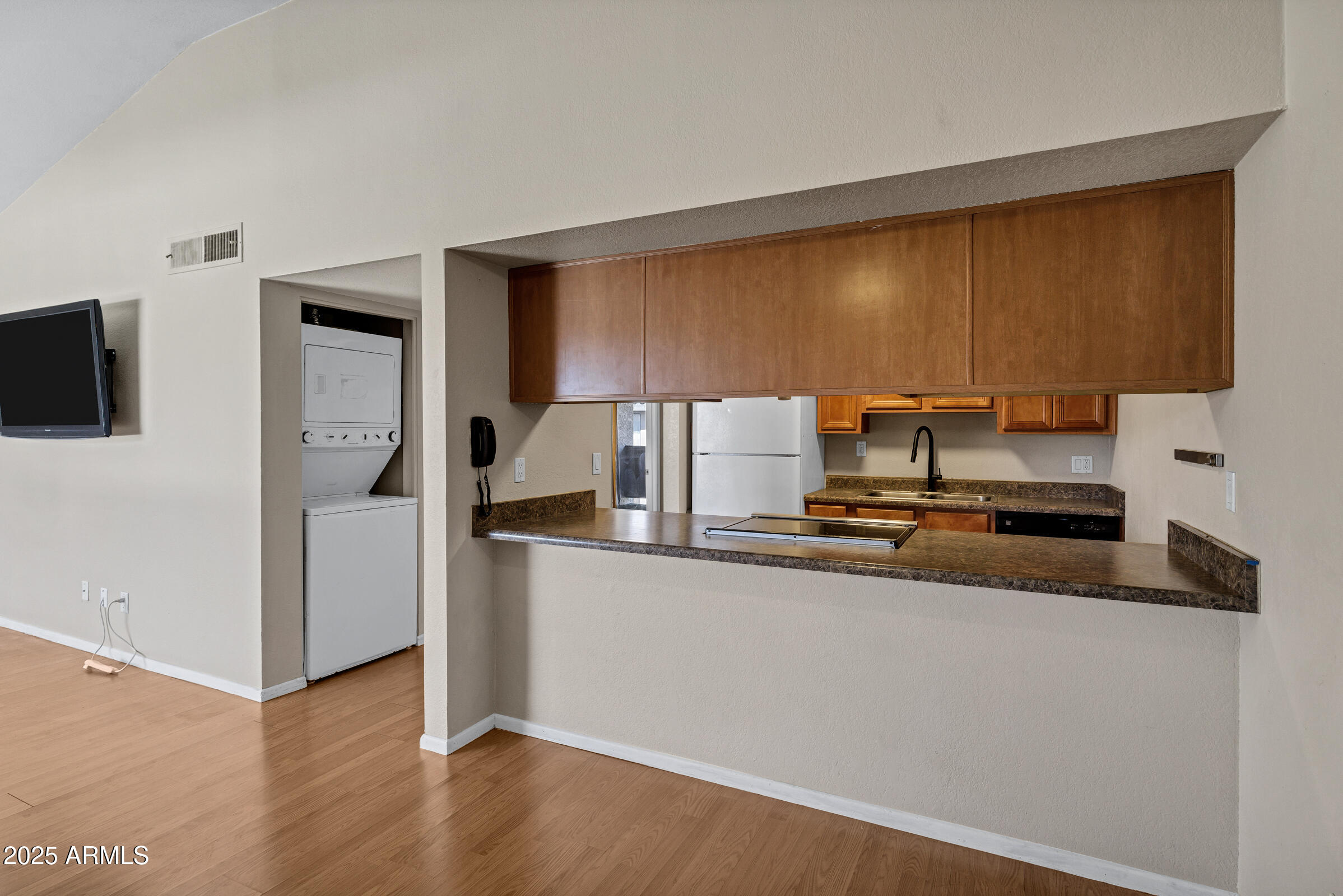 1402 East Guadalupe Road, Unit 248 Tempe, AZ 85283 - Photo 8 of 27 a kitchen with stainless steel appliances granite countertop a sink a stove and a refrigerator
