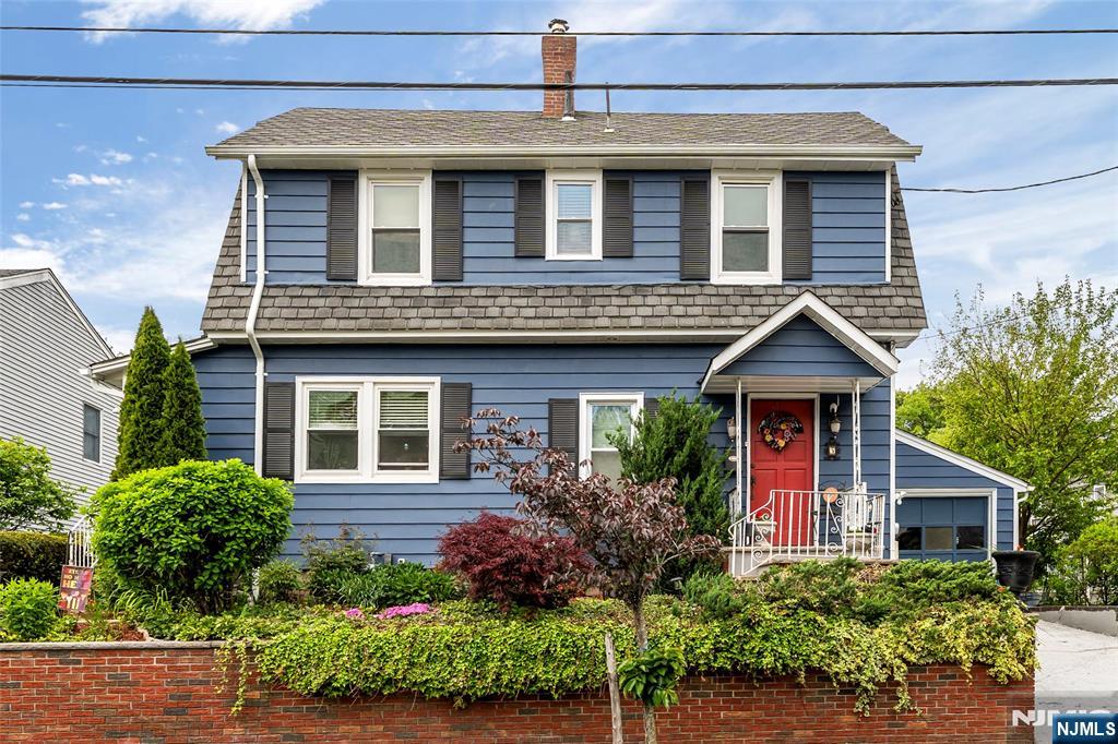 5 Leo Terrace Bloomfield, NJ 07003 - Photo 2 of 32 a front view of a house with a yard